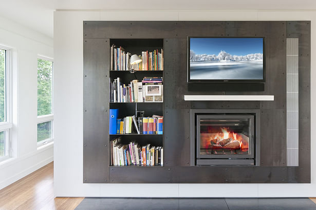 Fireplace with Black Steel Surround and Bookshelves