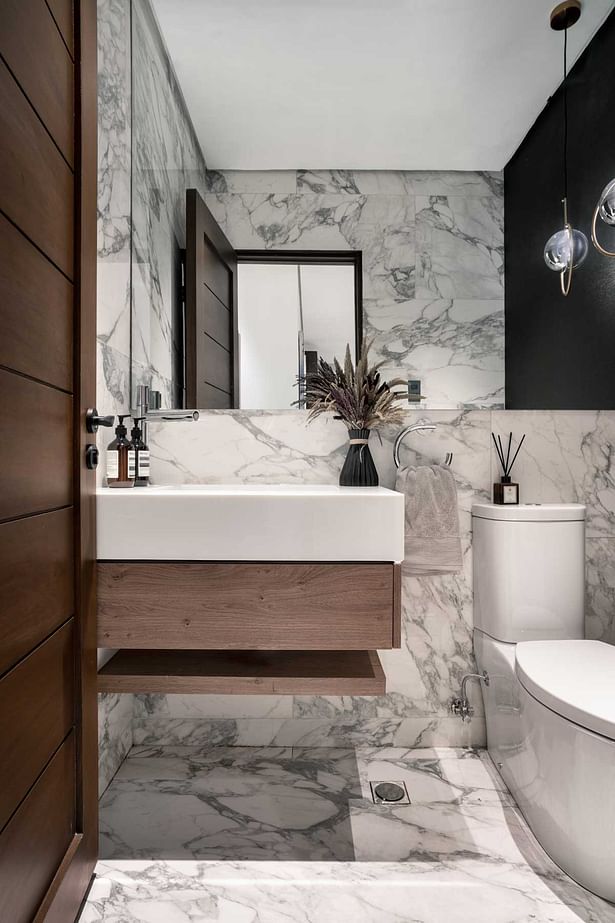 elegant white powder room design with the use of marble and wood