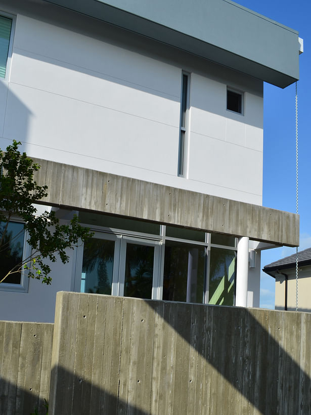 Exposed architectural concrete at front of home