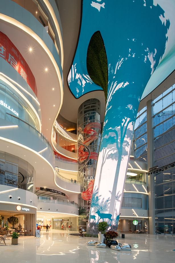 Sunken plaza with an enormous tree-like installation