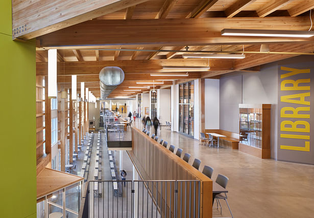 The commons feature timber framing with glue-laminated columns and beams, wood decking, and purlins for a biophilic approach that reduces embodied carbon.
