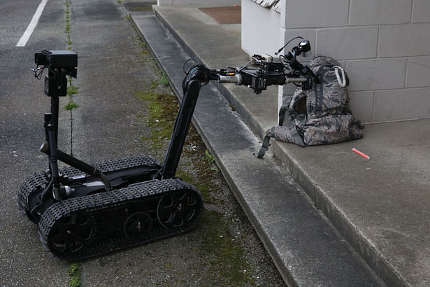 A US Navy Mark II Talon explosive ordnance disposal (EOD) robot inspects a simulated suspicious package during an anti-terrorism and force protection drill at Naval Air Station Whidbey Island, Washington, March 18, 2014.