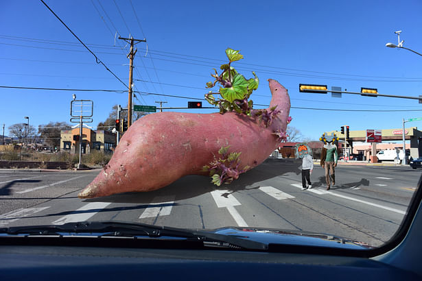 The Potato on a City Street With Two Masquerading People.