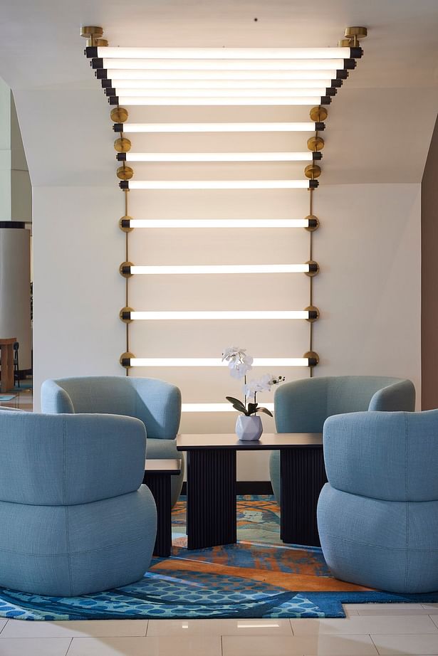 Backlit accent lighting adds energy and excitement to the lobby lounge space (credit: Noah Webb)