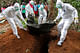 Burial of Ebola patients in Liberia. Image via www.habitatforhealing.wix.com/habitatforhealing