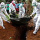 Burial of Ebola patients in Liberia. Image via www.habitatforhealing.wix.com/habitatforhealing