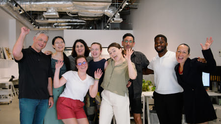 The Studio Luz Architects team at their Boston office (founding principals Anthony Piermarini and Hansy Better Barraza standing on the left and right). Image courtesy of Studio Luz Architects.