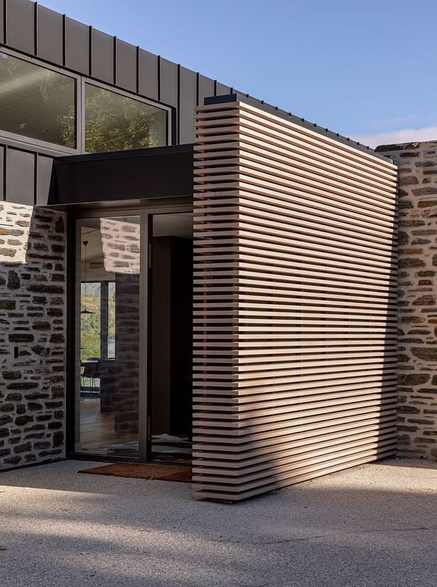 Lake Hayes Home, Queenstown, by Ben Hudson Architects - cedar batten entry wall