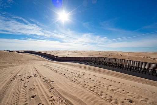 The U.S.-Mexico border wall “floats” across sand dunes in Yuma, Arizona. Photo: Jerry Glaser, 2019/Courtesy of U.S. Customs and Border Protection.