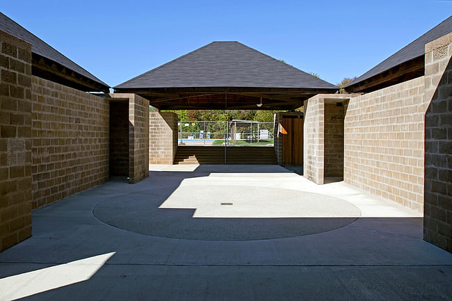 Trenton Bath House - Bath House interior after restoration, showing circular atrium feature (adapted from original design for ADA compliance), new historically accurate asphalt shingle roofs, and restored and cleaned CMU walls. Credit: Brian Rose