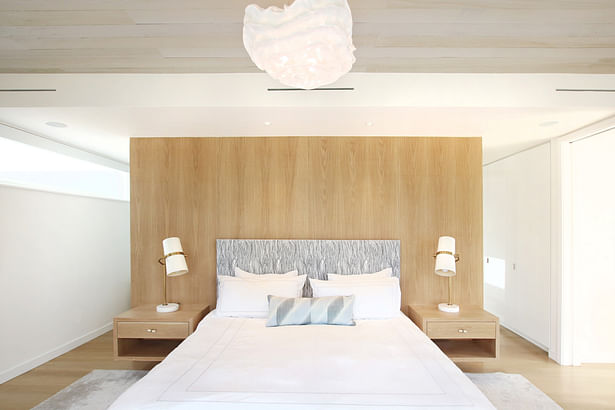 A White Oak Built-In Headboard Wall and Floating Nightstands in the Master Bedroom