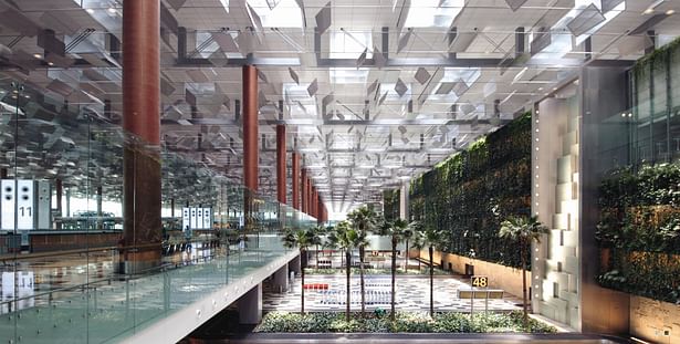 The design of Changi Airport Terminal 3 is enlivened through the interplay of voids and spaces, a feeling of openness and transparency, as well as the presence of water and abundant greenery. 