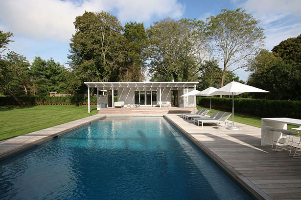 The Large Pool is Wrapped in Ipe Decking with a Small Pool House at its End