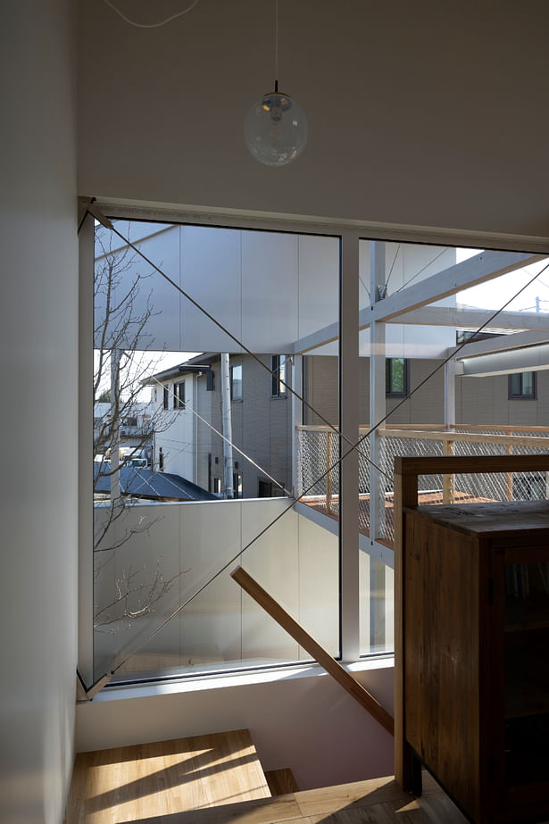 view to the garden and landscape while going up the stairs ©Mariko Yasaka