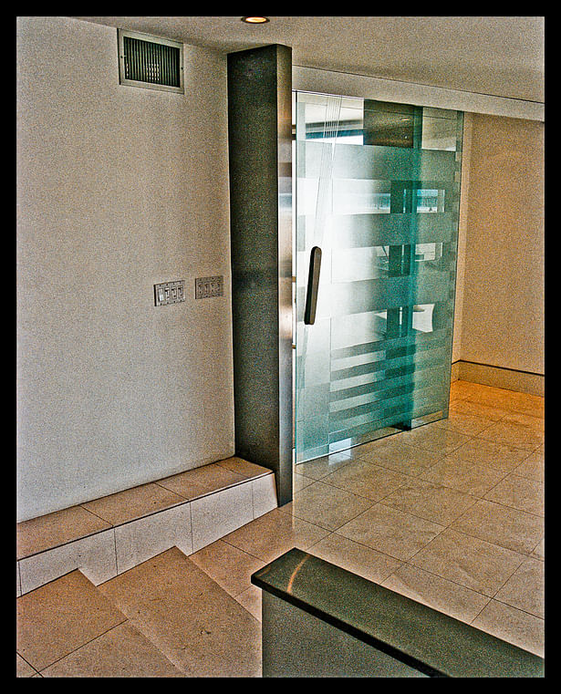 4'x8' suspended blasted glass door entry to master suite. Custom stainless hardware.