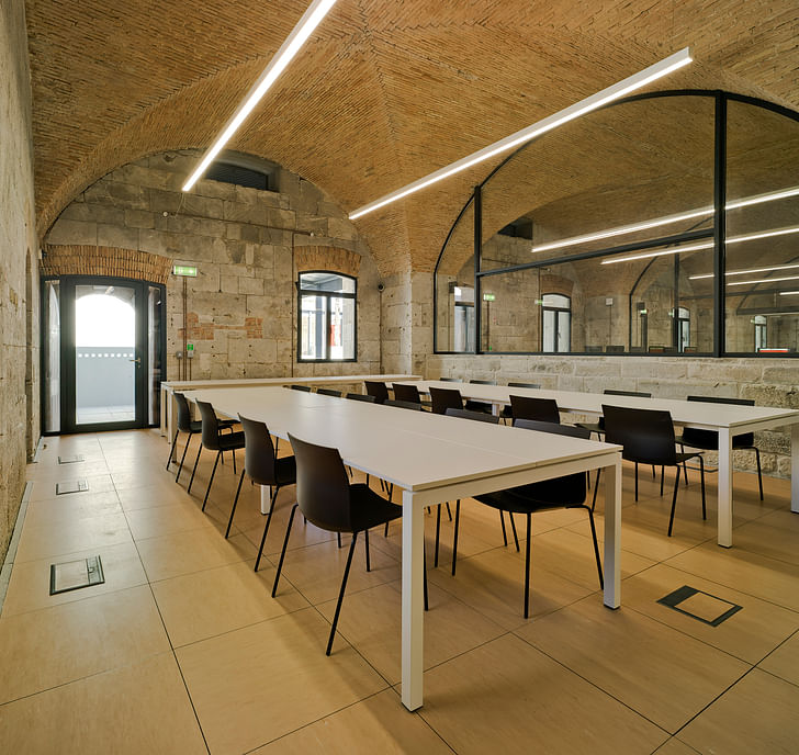 A room designed for management, including stone walls and brick ceilings from the original bunker