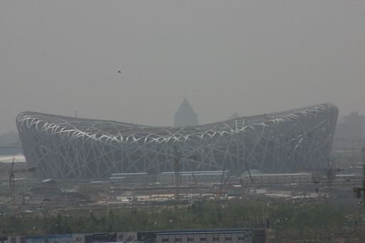 The Beijing National Stadium obscured by the city's infamous smog. Image via wikimedia.org.