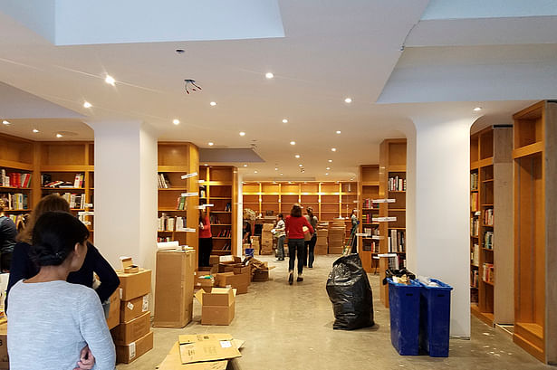 We join neighborhood volunteers stocking the shelves at Greenlight just before its opening.