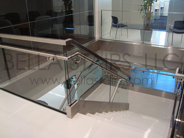 Stainless Steel handrails are mounted directly onto the glass panels