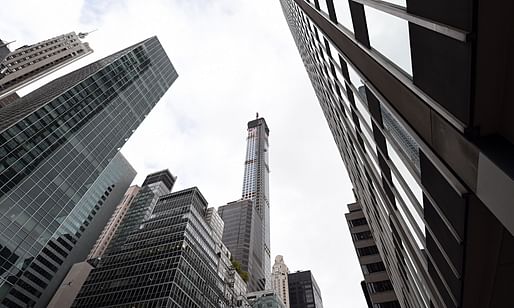 A $95M penthouse atop Manhattan's 432 Park Avenue buys you a healthy amount of natural light — at the expense of the not-so-well-off city residents. (Photo: Timothy A. Clary/AFP; Image via theguardian.com)
