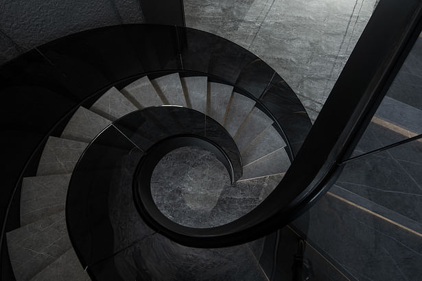 A curved staircase shaped like a sculpture