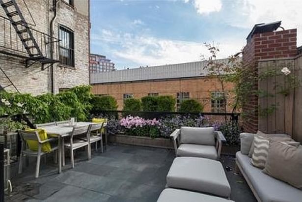 Finished roof deck with permeable slate pavers Photo by Douglas Elliman real estate