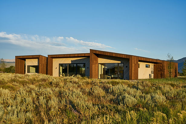 A series of three Douglas fir and cedar-clad, connected pavilions compose the architecture on the two and a half-acre parcel. 