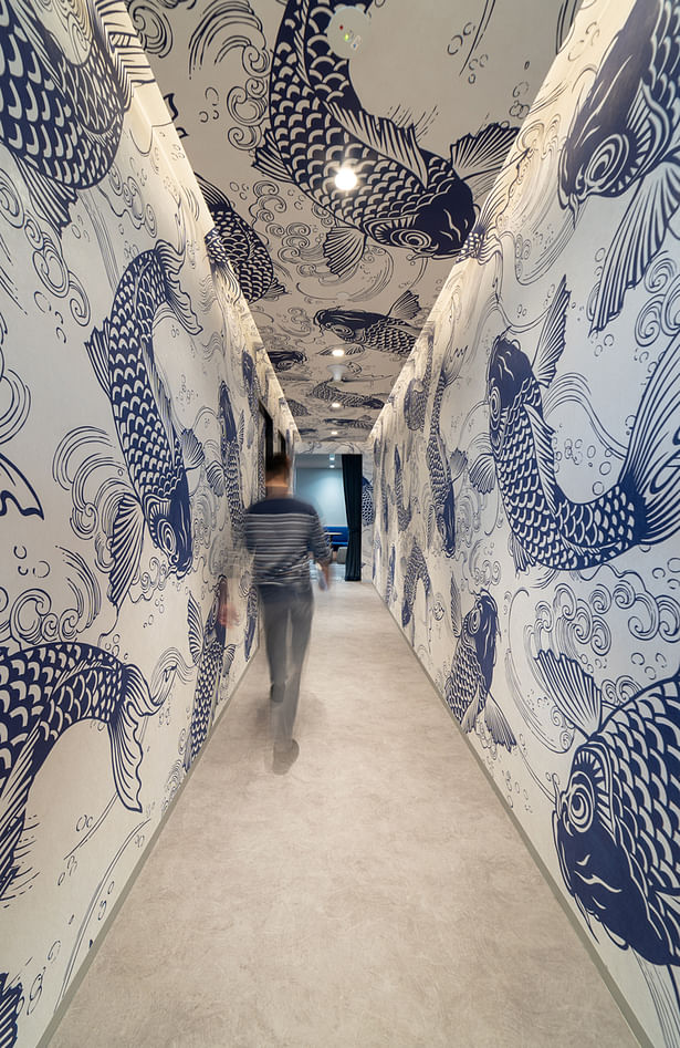 The “Barista Corridor”, leading to “The Social” cafe, is designed as a feature tunnel with a bold full-height, full-span oriental art-inspired wall mural. This optically enlarges the corridor and give it personality, depth and a sense of dynamic movement - creating a fun work environment.