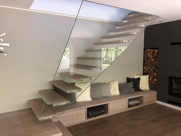 Floating Mistral design staircase supported by single sheet of low iron structural glass. 