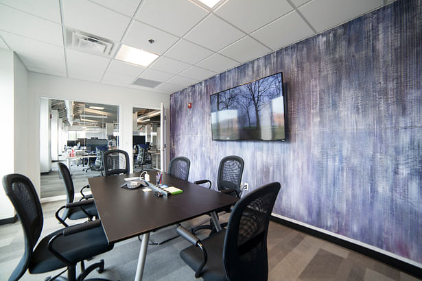 Deepfield conference room with painting by Taduesz Bazydlo.
