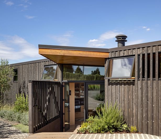 Board and batten cedar siding takes a note from the agrarian region. PHOTOGRAPHER: Andrew Pogue