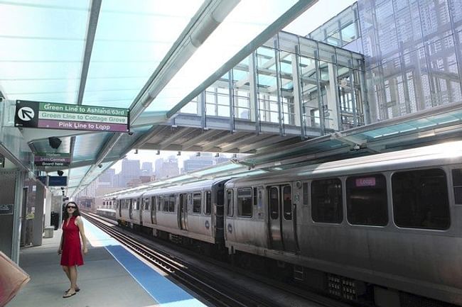 An inbound train passes under the sky bridge at the CTA's new Morgan station on the Near West Side. (Chuck Berman, Chicago Tribune / May 29, 2012) 