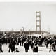 In 1933, the Standard Oil Company sent employee Ted Huggins to photograph the bridge's construction. Huggins visited the site weekly for three years and produced hundreds of photographs, which he offered to news outlets covering the project. Huggins took this picture on the bridge's opening day on May 27, 1937. (Image credit: Ted Huggins/Chevron Corporation)