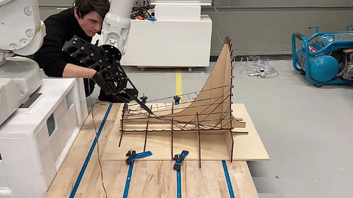 U Penn Professor Ezio Blasetti observing robots fabricating installation components. Image courtesy of the Weitzman School of Design. 