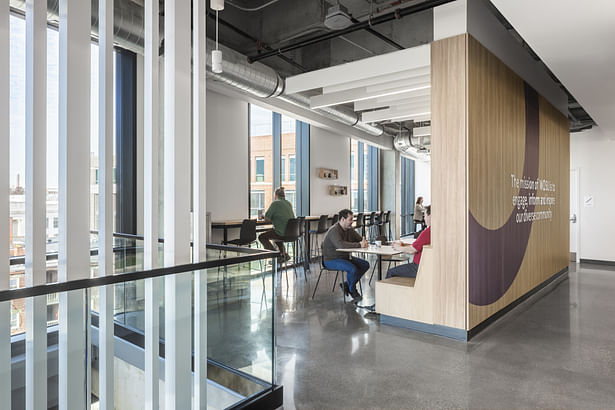 A cafe offers views and additional spaces for gathering.