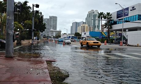 In November 2013, a full moon and high tides led to flooding in parts of the city, including here at Alton Road and 10th Street. (The Guardian; Photograph: Corbis)