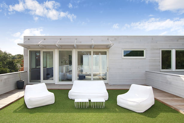 One of Three Roof Decks Off the Second Story, Artificial Turf Tiles Create a Soft for the Kids to Play and Lounge
