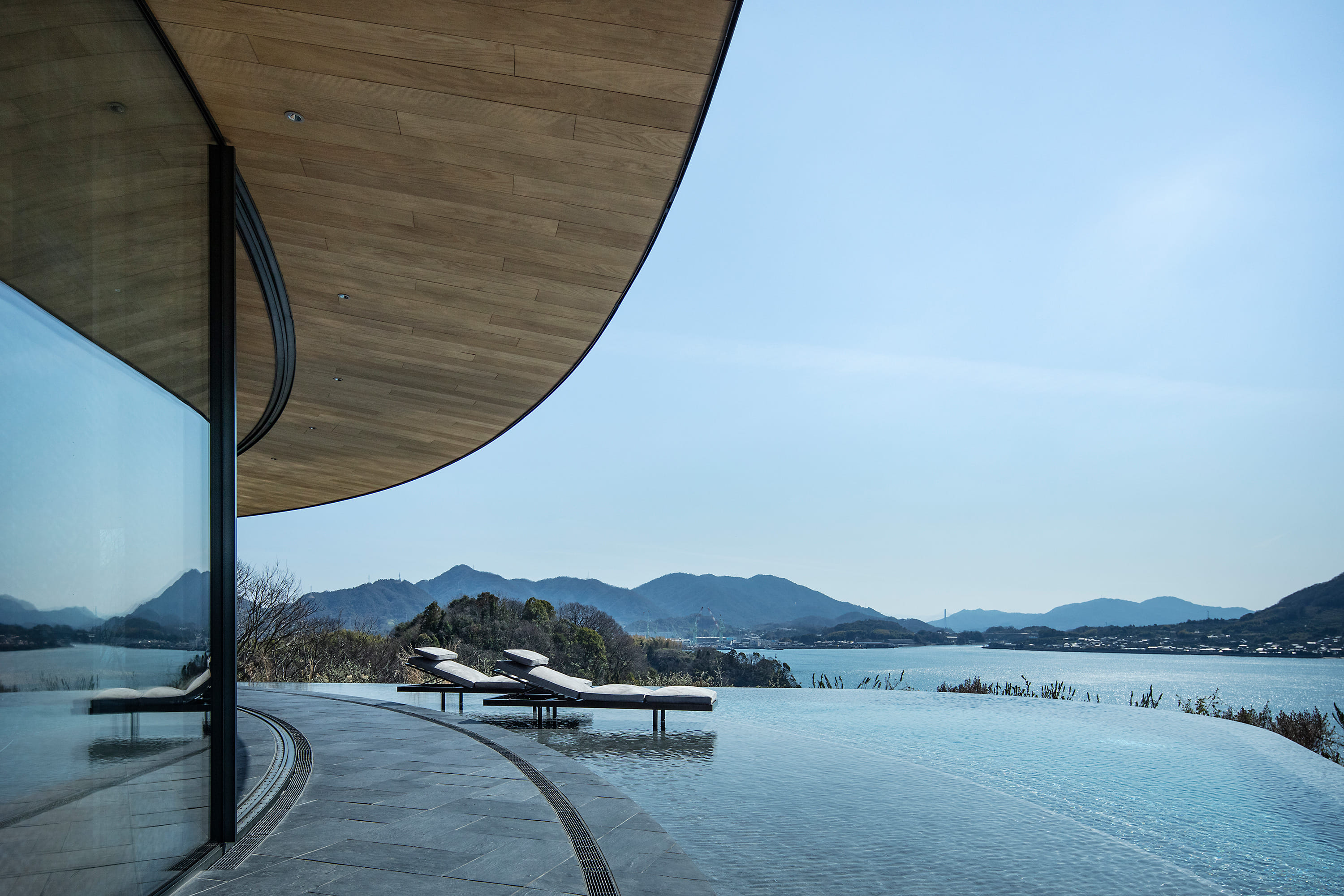 Island vistas and rammed earth star in BIG's Japanese NOT A HOTEL