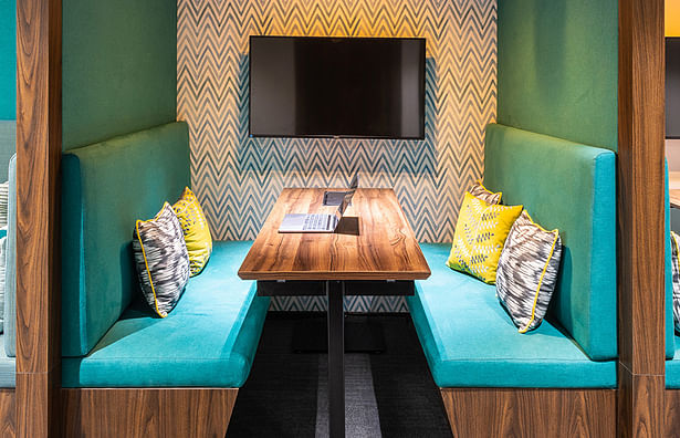 Turquoise seating meeting booths by Space Matrix for BrowserStack