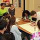 Two architecture grad students from the University of Maryland visited Mayo's English class and taught his students how to construct their models. Photo courtesy of George Mayo