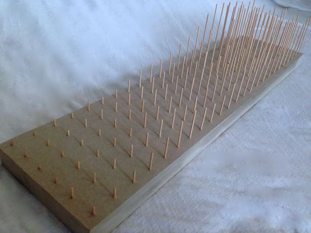 Point model built of 1/16' bass wood dowels at 1'=20' intervals, on a 1' base of 1/8' chipboard. 8'x40'.