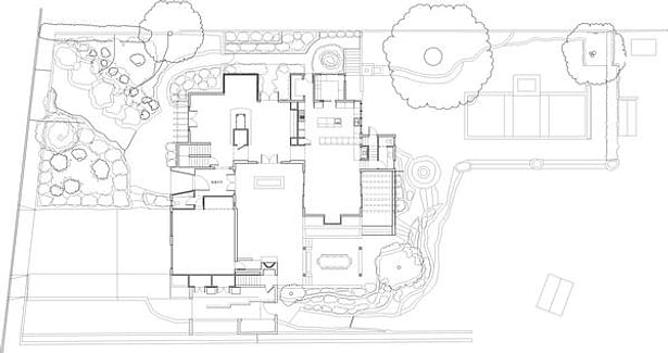The site plan shows the placement of the U-shaped residence. The topography lines delineate a 14 foot drop in grade from the street to the back yard. The house dances down the slope.