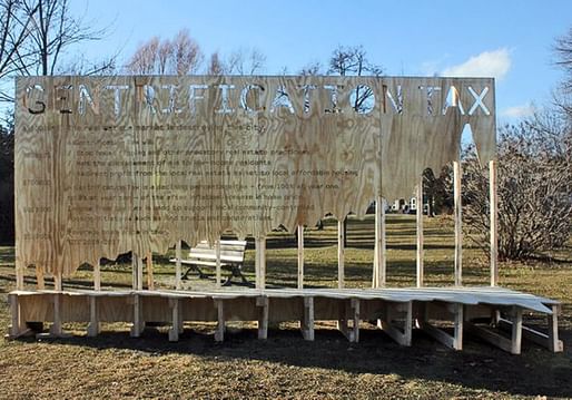 The proposed “Gentrification Tax” was publicly displayed on a plywood billboard in Toronto's Trinity Bellwoods park recently. Photo via The Globe and Mail.