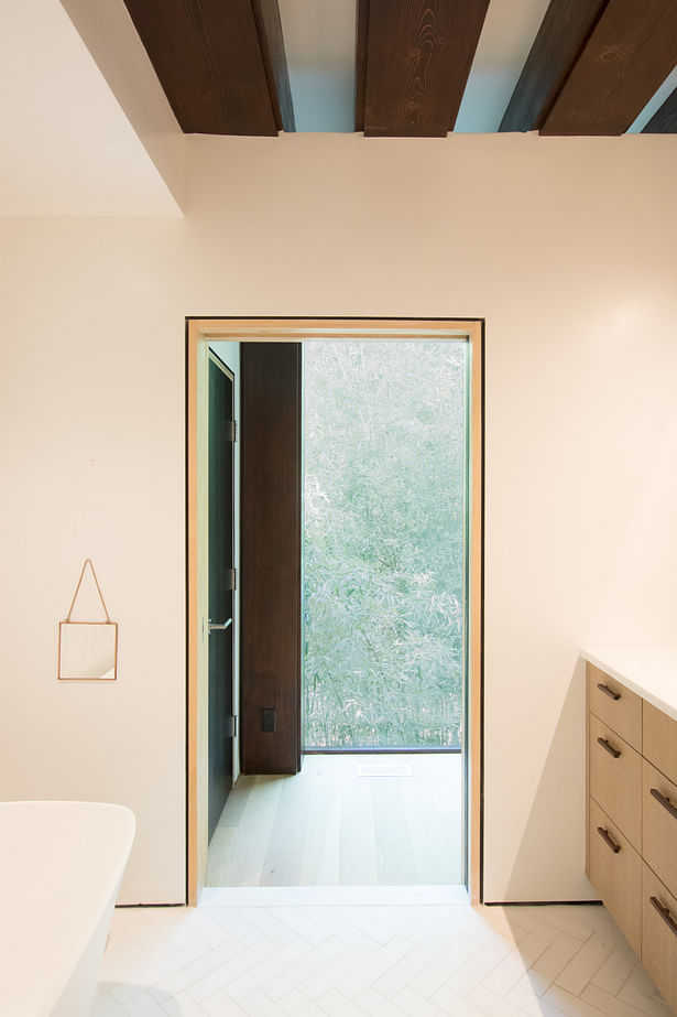 The thicket of bamboo to the rear also offers a lovely view and privacy to the primary bathroom.