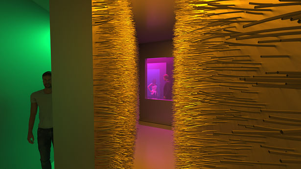 A space with hairy walls encouraging touch and interaction. Windows in the distance allows visual communication with another hallway in the maze