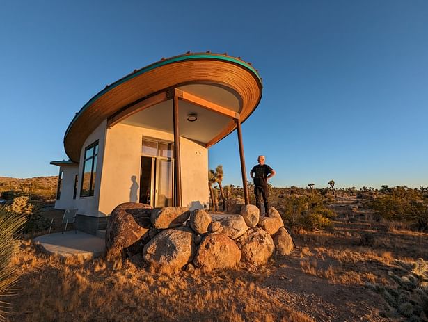 The east patio is enclosed by boulders.