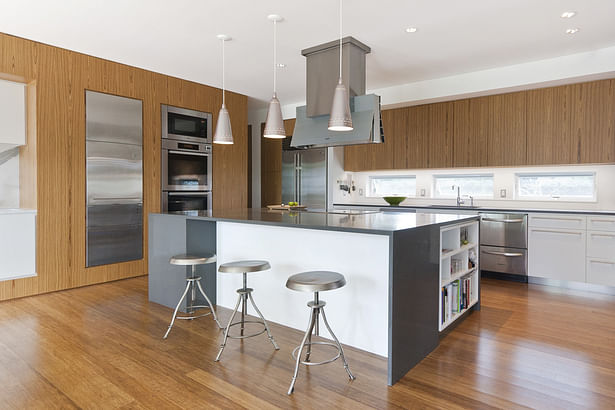 Open Kitchen with Large Central Island and Teak Cabinetry