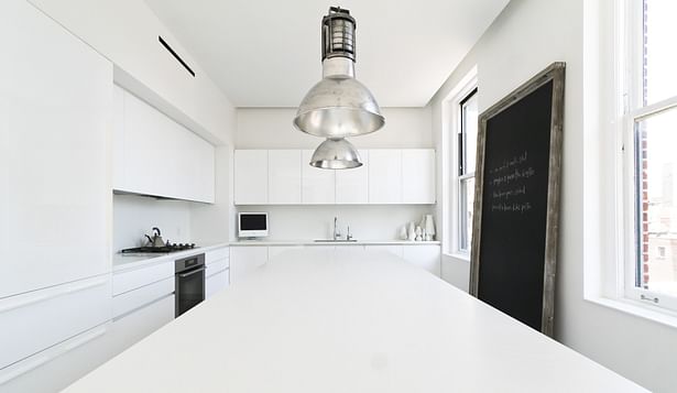 Kitchen with White Corian Countertops
