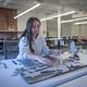 Amy Nguyen, a graduate student in the Masters of Resilient Urban Design program, builds a model of the Charleston city marina.