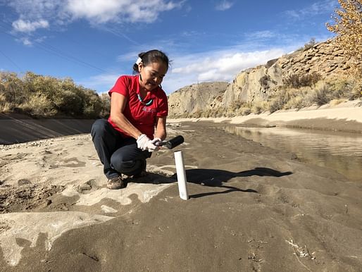 Karletta Chief, an associate professor and Extension specialist in the UArizona Department of Environmental Science and the new center's director, pounds a soil sample tube into the Hogback irrigation canal near Waterflow, New Mexico, on the Navajo Nation in 2017. Image: The University of...